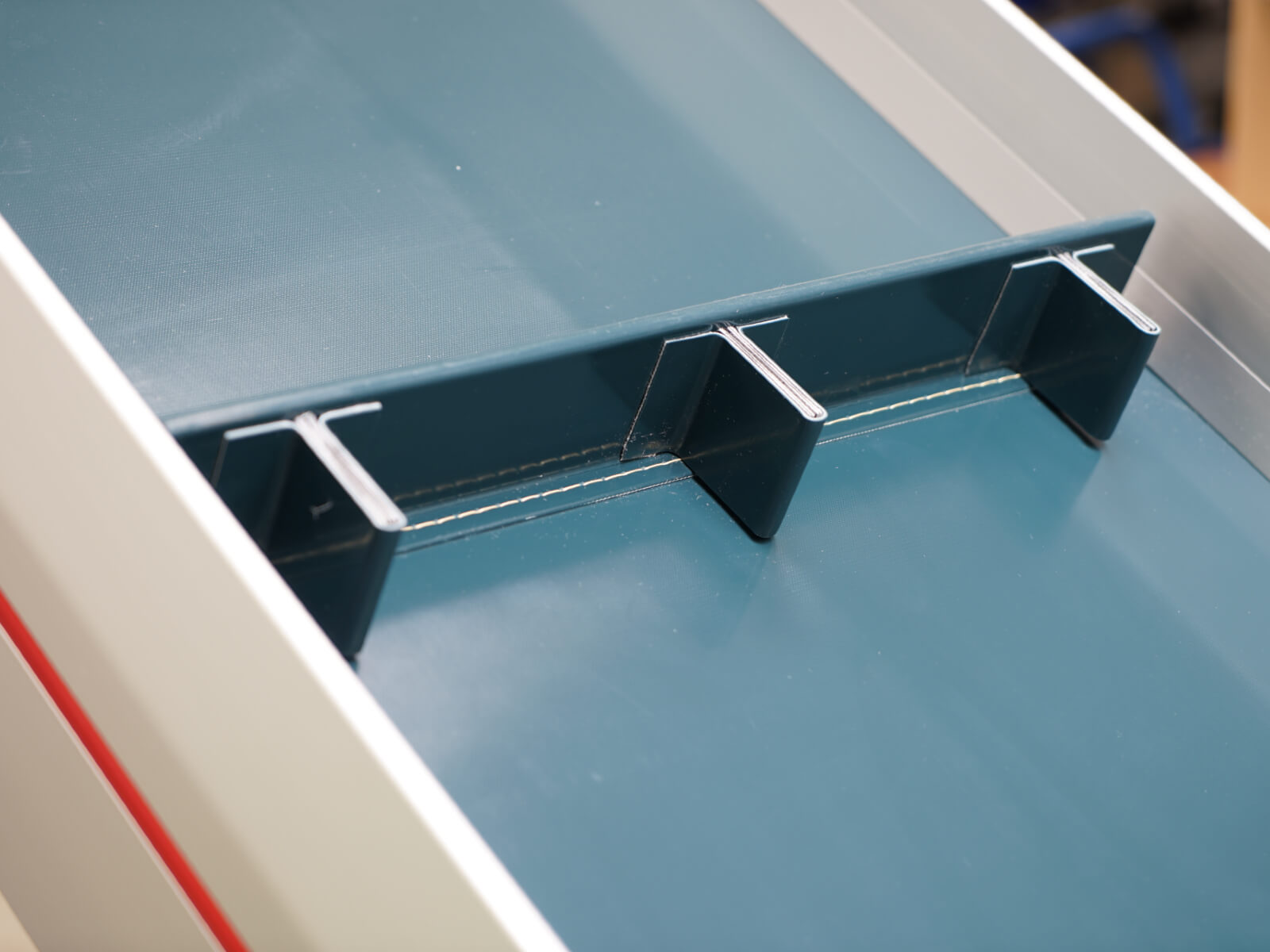 Transporting Cleats in a fortified version as accessory for conveying belts